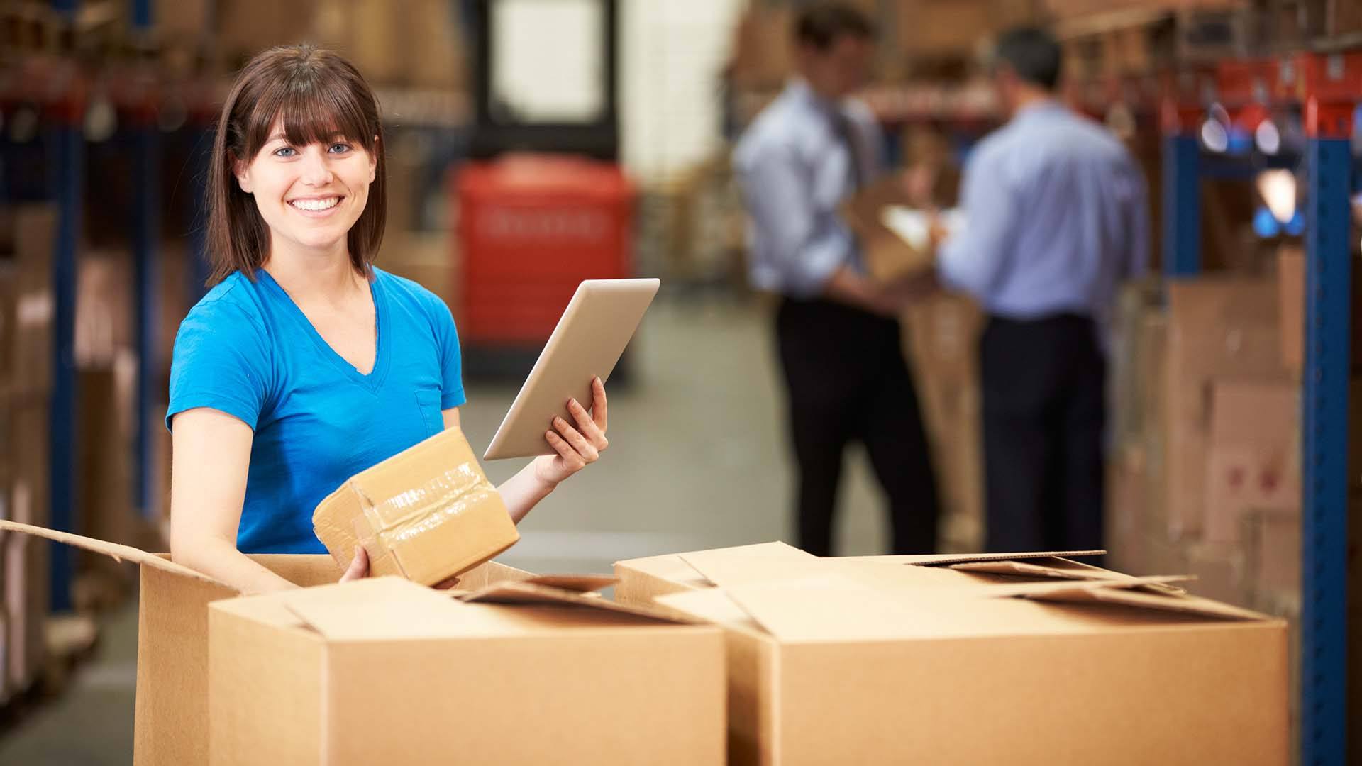 Logistics employee checks shipping package